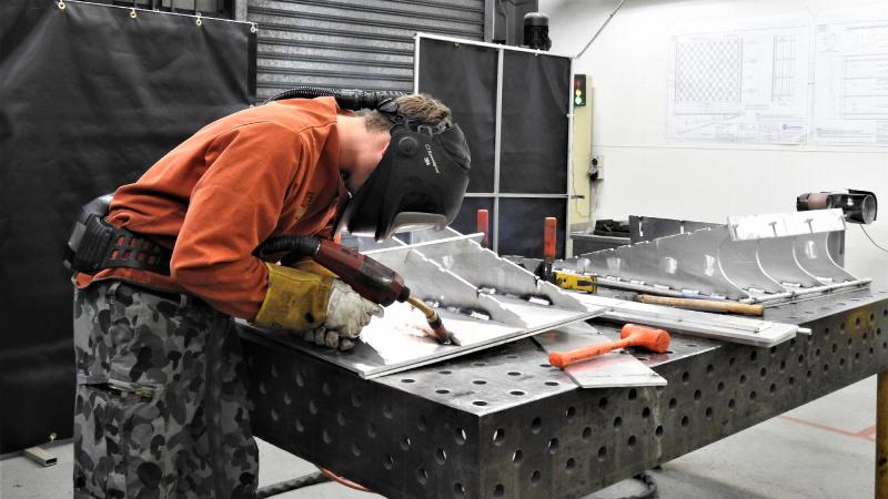 Leading Seaman Marine Technician Trent Goodman welds the loading ramp at Fleet Support Unit – North East, Cairns, Queensland.