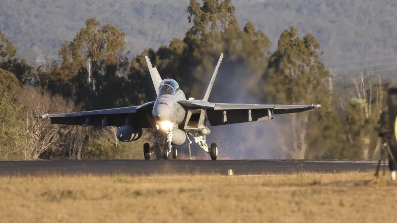 A F/A-18F Super Hornet lands while engaging the aircraft arrestor cable at RAAF Base Amberley in Queensland. Photo: Corporal Colin Dadd