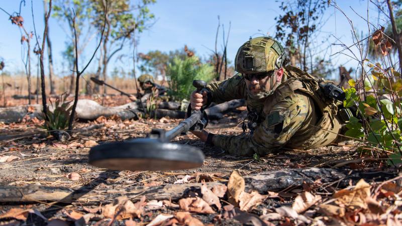 Sapper Lewis Coulter sweeps for mines during the 1st Combat Engineer Regiment Commanding Officers' Challenge held at Robertson Barracks, Northern Territory. Photo: Private Rodrigo Villablanca 