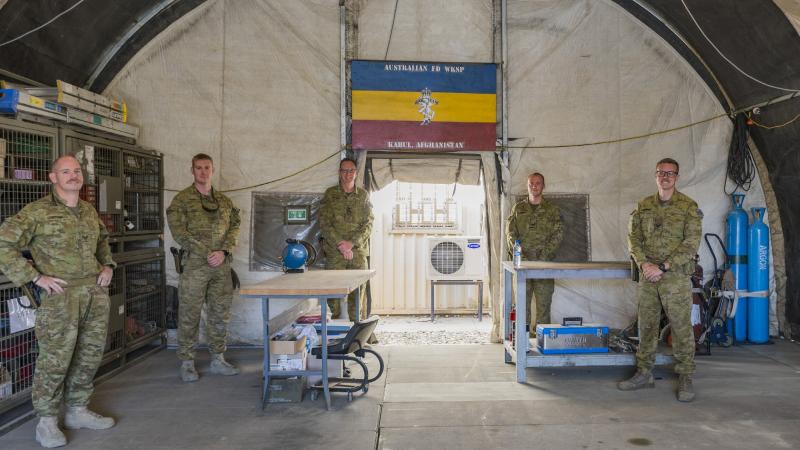 Commander Task Group Afghanistan Brigadier Ed Smeaton, centre left, opens a deployable field workshop along with fellow REAME Corps members at Hamid Karzai International Airport in Kabul Afghanistan.