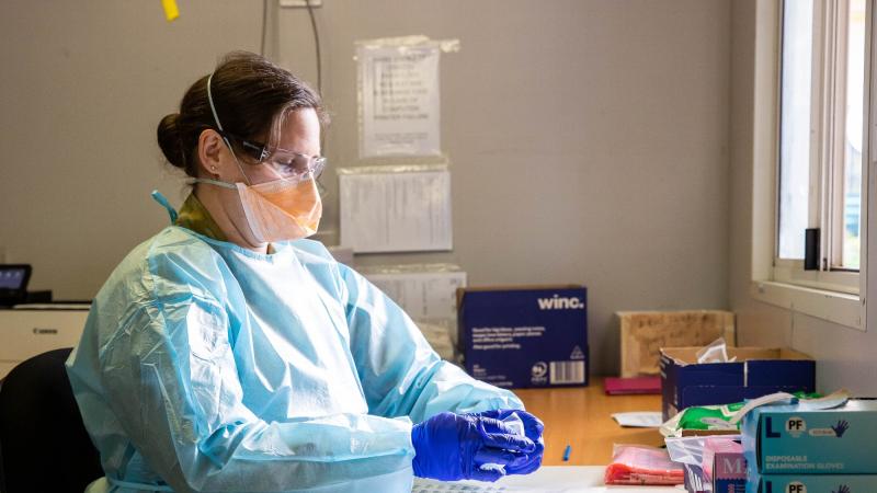 Sergeant Nicola Emsley prepares a COVID-19 testing swab at the Goulburn Valley Health testing site in Shepparton, Victoria during Operation COVID-19 Assist. Photo: Private Dustin Anderson