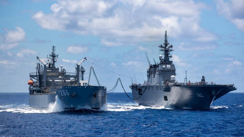 HMAS Sirius conducts a replenishment at sea with Japanese Ship Ise in the southern waters of Hawaii during Exercise RIMPAC. Photo: Leading Seaman Christopher Szumlanski