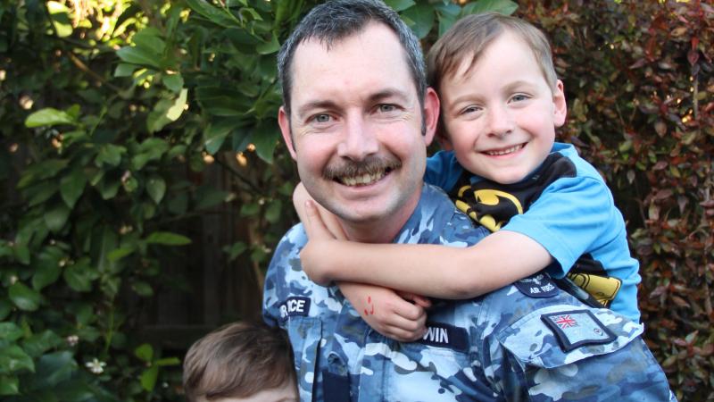 Aircraft technician Corporal Jeremy Lewin, from No. 36 Squadron, at his Ispwich home with sons Joshua, 8, and Ethan, 5. Photo: Danielle Lewin