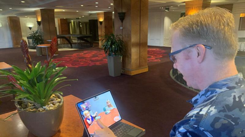 Leading Aircraftman Moncrieff on a video call to daughter Daphne and son Quinn. 