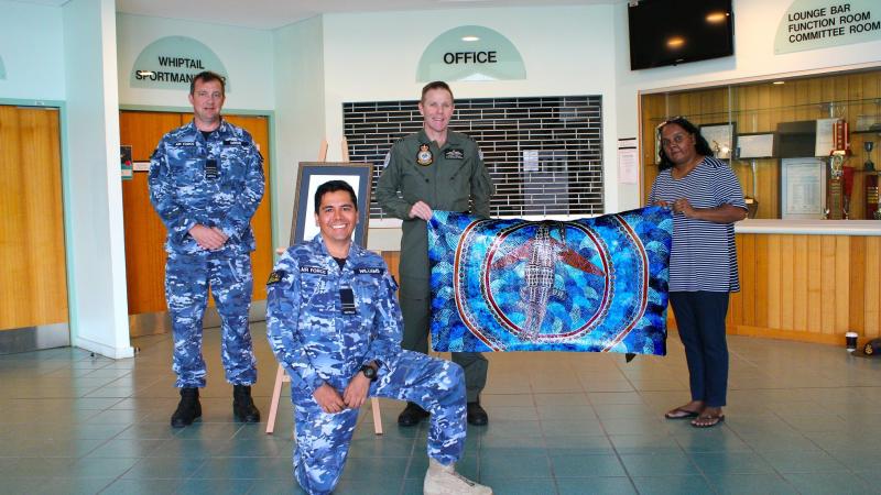 Indigenous Liaison Officer Flight Lieutenant David Williams, Wing Commander Mat Green, Squadron Leader Simon Longley and Linda Oliver at the Combat Survival Training School at RAAF Base Townsville. 