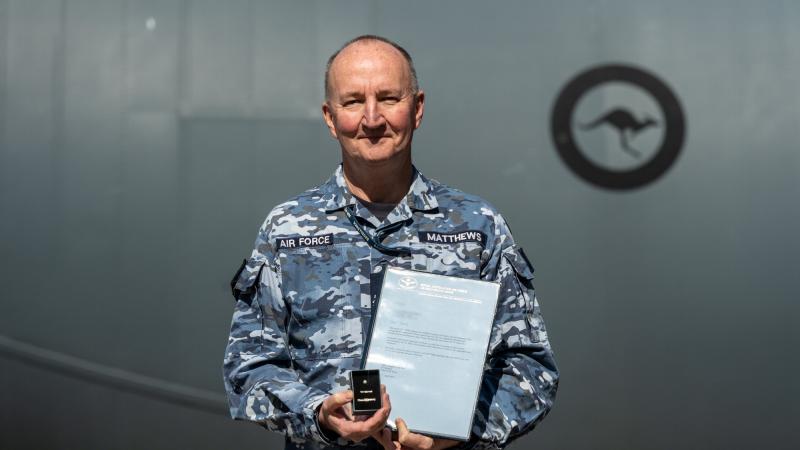 Warrant Officer Stuart Matthews receives his Federation Star and the fifth clasp to his Defence Long Service Medal at RAAF Base Richmond, NSW. Photo: Gordon McComskie