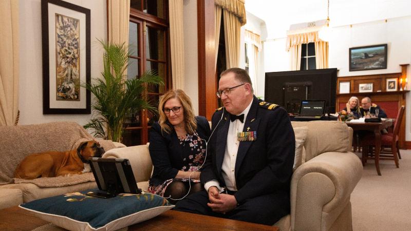 Director General Chaplaincy - Air Force, Principal Air Chaplain Mark Willis and his wife Lisa Willis chat to attendees at a virtual dining table during the  virtual dinner. Photo: Corporal Kylie Gibson