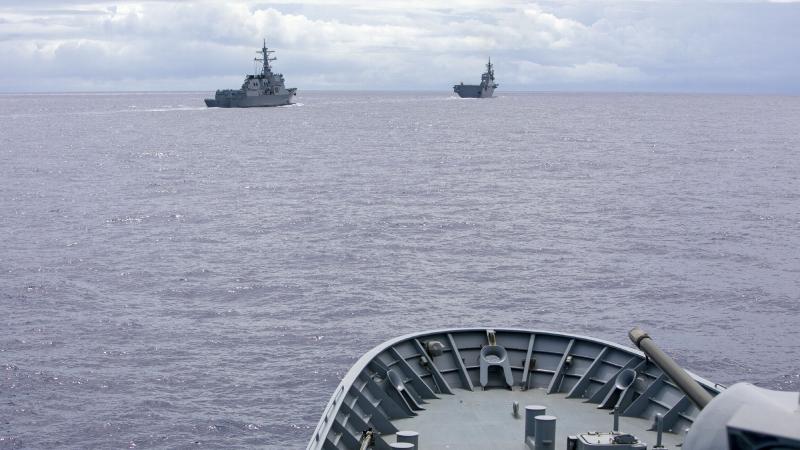 HMAS Arunta practices officer of the watch manoeuvres with Korea’s Seoae Ryu Sung Ryong, left, and JS Ise during the Regional Presence Deployment. Photo: Leading Seaman Ernesto Sanchez 