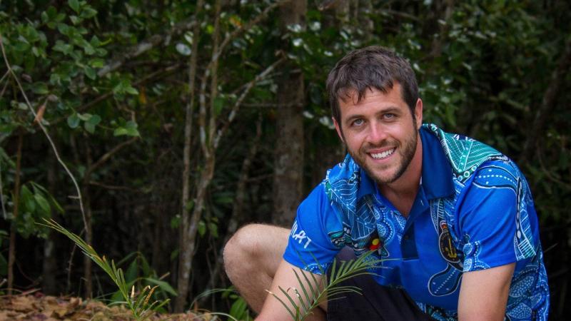Leading Seaman Jerry Dibella helps the traditional owners of Mossman in Far North Queensland planting traditional bush tucker plants. Photo: Leading Seaman Breanna Jacobs-Rochford