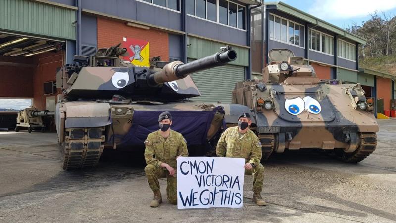 Army personnel with the School of Armour’s M1A1 main battle tanks wearing the giant mask as part of the AFP’s social media campaign called #MaskUpMelbourne.