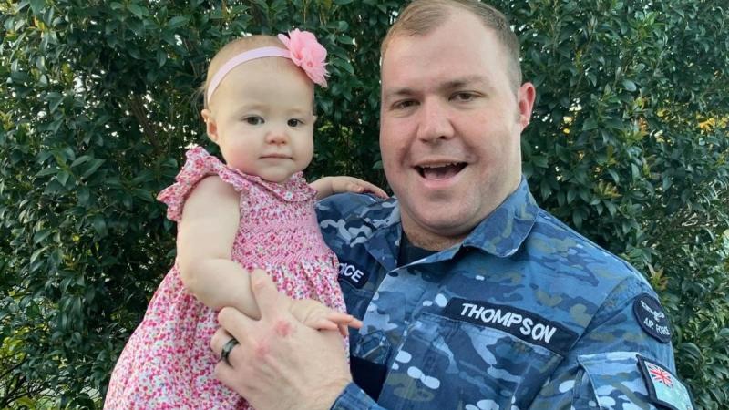 Leading Aircraftman Andrew Thompson with baby girl Maddison. Photo: Corporal Emma Thompson