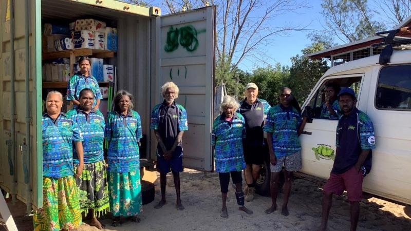 Wuyagiba locals welcome the arrival of a shipping container donated by 8 Brigade for use in the community's study hub.