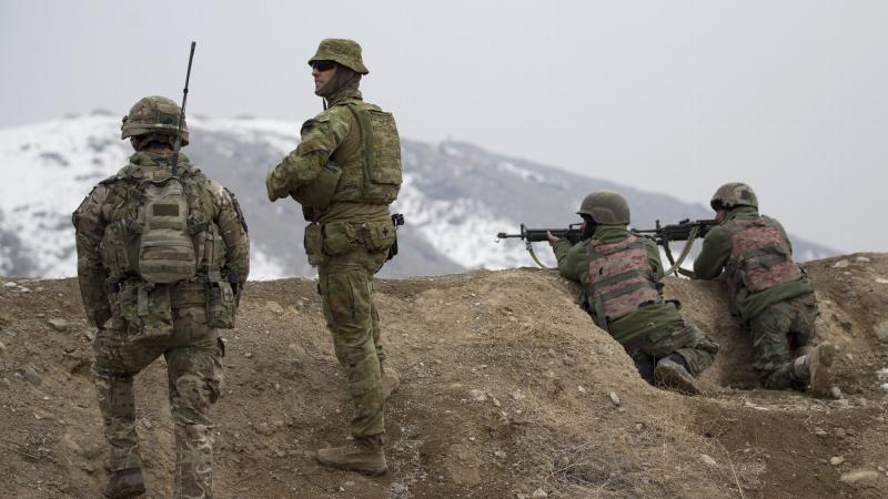 Australian Army officer Captain Gerard Donnelly mentors instructors from the Afghan National Officer Academy in Qargha, Afghanistan. Photo: Lieutenant Todd Fitzgerald 