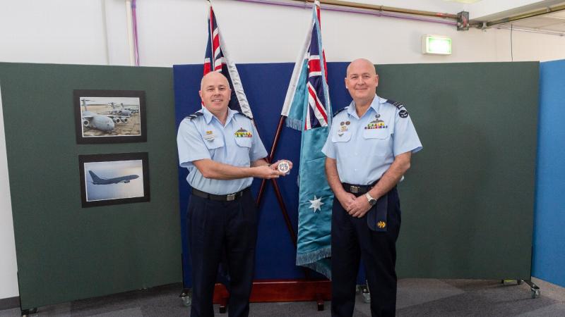 Commander Air Warfare Centre Air Commodore Brendan Rogers, left, presents Squadron Leader Peter Knox with his medallion at RAAF Base Edinburgh. Photo: Leading Aircraftwoman Jacqueline Forrester