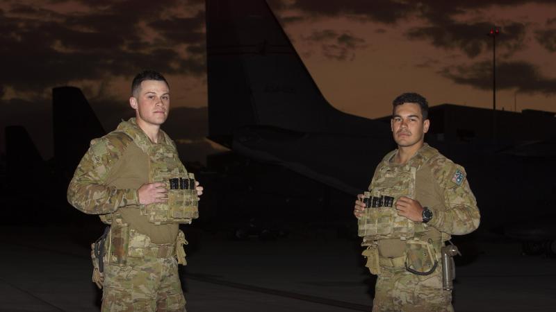Security and Fire School trainees Aircraftman Mitchyll Flanagan and Jayden Woodley during a patrol of the No. 35 Squadron flight line at RAAF Base Amberley. Photo: Corporal Jesse Kane
