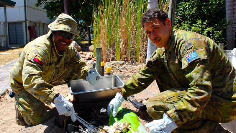 No. 2 Security Forces Squadron Airfield Defence Guard Leading Aircraftman Pryce Mareko, left, and 5 Aviation Regiment Life Support Fitter Craftsman Christopher Morganson at RAAF Base Townsville.