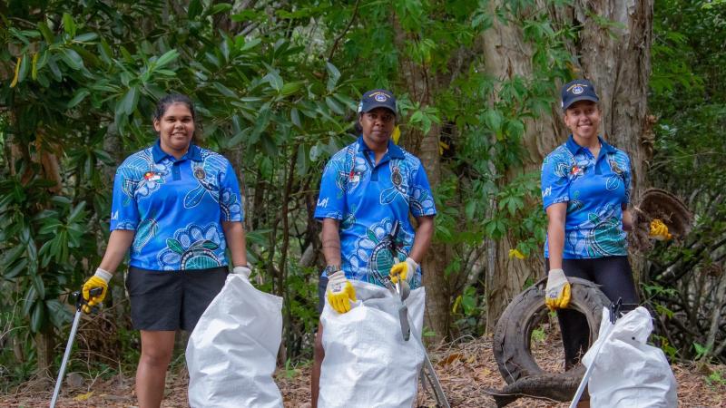 Recruit Cherine Savage, left, Recruit Trudy Salt and Recruit Vicki-Thyssen Lamb collect rubbish during the Great Northern Clean Up at Holloways Beach in Northern Queensland.