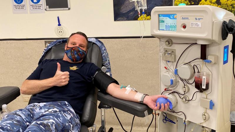 Air Force Band Commanding Officer Squadron Leader Mark Pentreath donates during the Defence Blood Challenge.