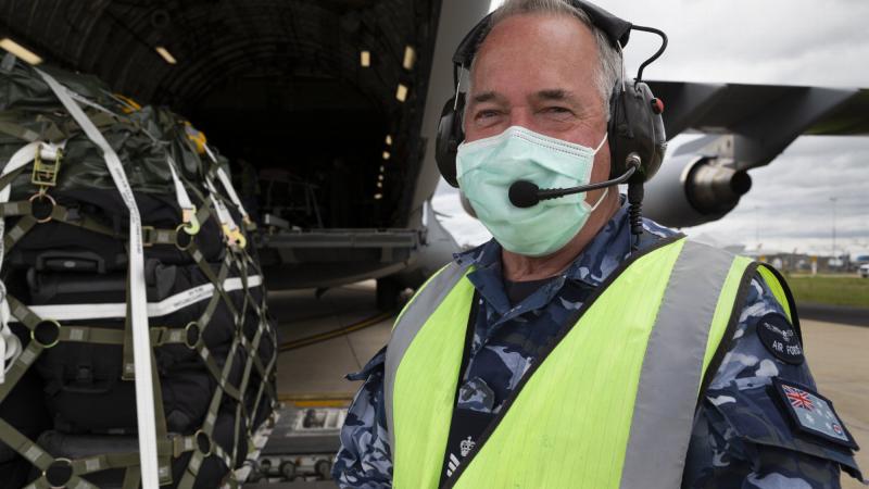 Flight Sergeant Edward Wills helps load a C-17A Globemaster III aircraft at Avalon Airport during Operation COVID-19 Assist. Photo: Sergeant Kirk Peacock