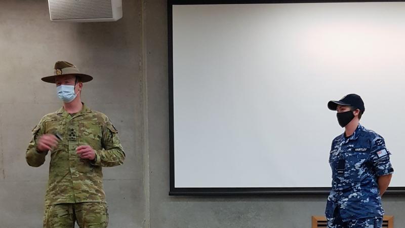 Commander JTG629.2 Brigadier Matt Burr promotes Flight Lieutenant Lauren Hartley while deployed on Operation COVID-19 Assist in Victoria. Photo: Fligt Lieutenant Tracy Spiteri