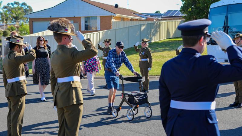 Australia's Federation Guard provides a guard of honour as Sergeant Bert Le-Merton completes his 96km fundraising walk for Soldier On. 