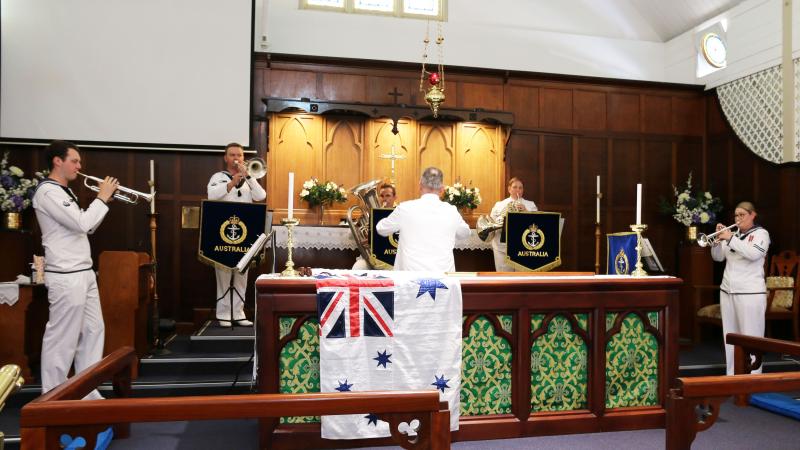 Personnel from HMAS Moreton attend the annual Navy Week church service in Brisbane, Queensland. 