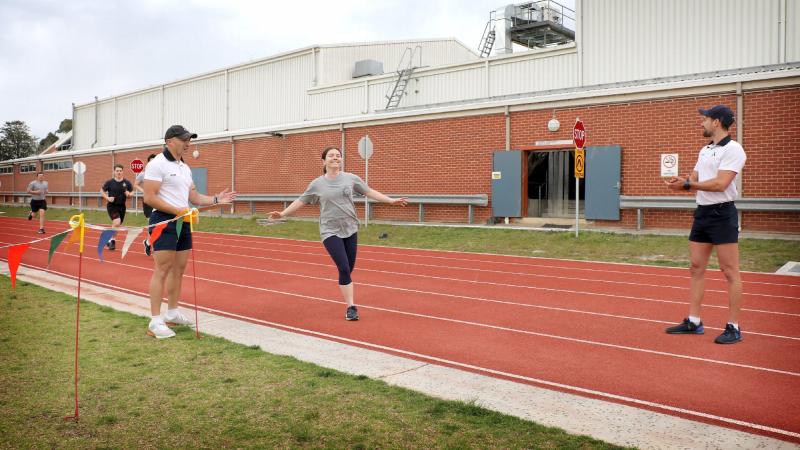 Physical Trainers Leading Seaman Robert Pope and Leading Seaman Louis Tanner conduct the ‘relay for lockdown’ fitness challenge at HMAS Cerberus, in Victoria. Photo: Petty Officer Nina Fogliani 