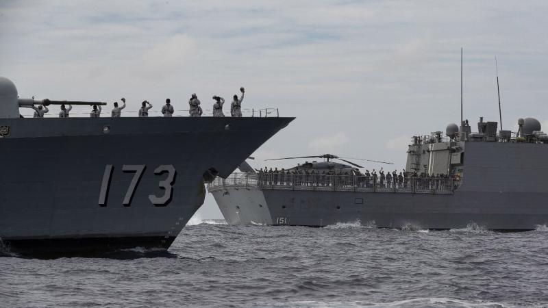 KD Perak, of the Royal Malaysian Navy, left, with HMAS Arunta during a passage exercise on the East Asia Deployment. Photo: Leading Seaman Jarrod Mulvihill 