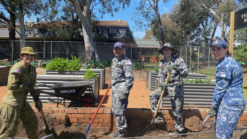 Officer Cadet Ciska Roodt, left, Mishipman Riz Asuncion, Midshipman Hayden Eadie and Officer Cadet Erin McKelvie construct new gardens during Exercise Weary Dunlop. 