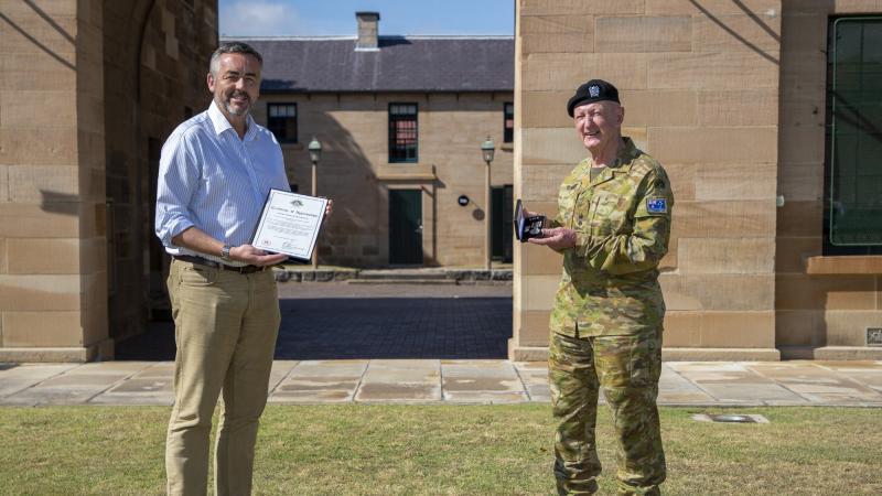 Minister for Defence Personnel Darren Chester presents Lieutenant Colonel Peter Curran with the sixth clasp to his Long Service Medal at Victoria Barracks in Sydney. Photo: Corporal Chris Beerens