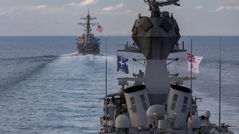 HMAS Ballarat sails with USS John S. McCain in the Strait of Malacca while sailing for Exercise Malabar. Photo: Leading Seaman Shane Cameron