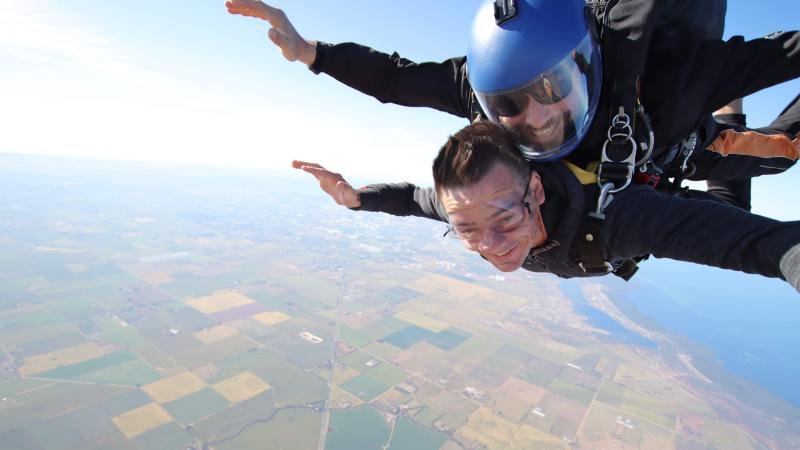 Warrant Officer Mark Hollingsworth, underneath, does tandem jump with Lieutenant Commander Martin Lee in Adelaide.