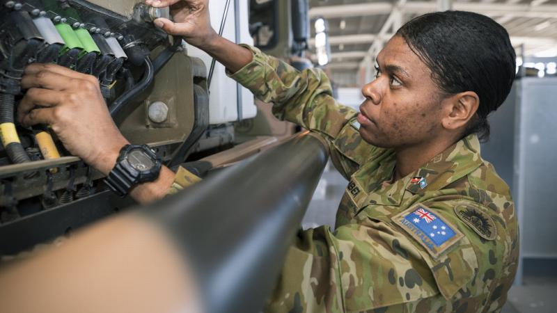  Private Pamela Amber conducts an inspection of a vehicle at Lavarack Barracks, Townsville. Photo: Private Madhur Chitnis