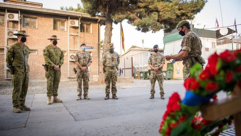 British Army officer Major Andrew Bell delivers a speech to Coalition personnel in Kabul, during the memorial service. 