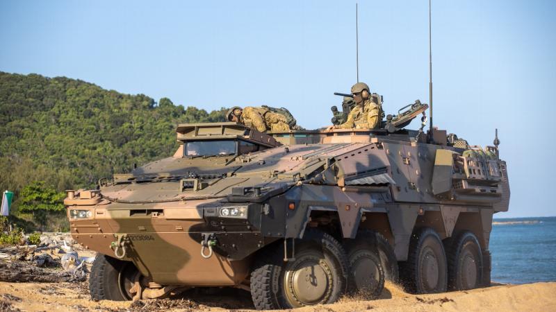 Soldiers of the 2nd/14th Light Horse Regiment (Queensland Mounted Infantry) test the Army’s new Boxer Combat Reconnaissance Vehicle on the beach during Exercise Sea Wader at Cowley Beach Training Area. Photo: Trooper Jonathan Goedhart