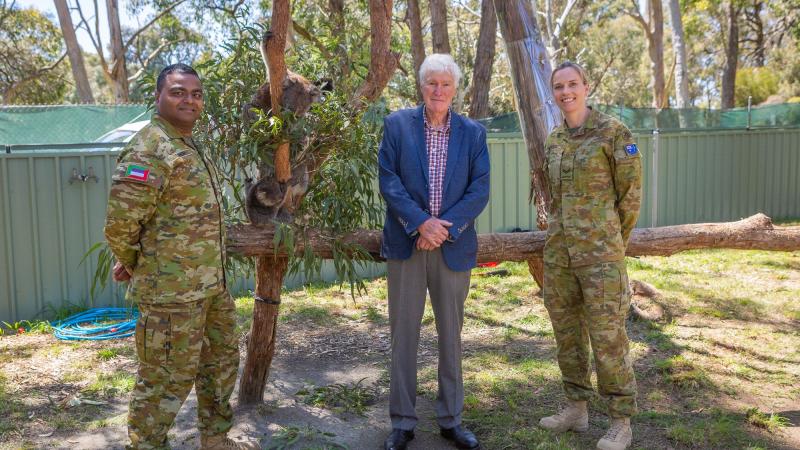 Private Anil Sansri, left, Councillor Bob Teasdale and Corporal Amy Broham at Cleland Wildlife Park with koalas rescued on Kangaroo Island during Operation Bushfire Assist. Photo: Leading Aircraftman Jacqueline Forrester 
