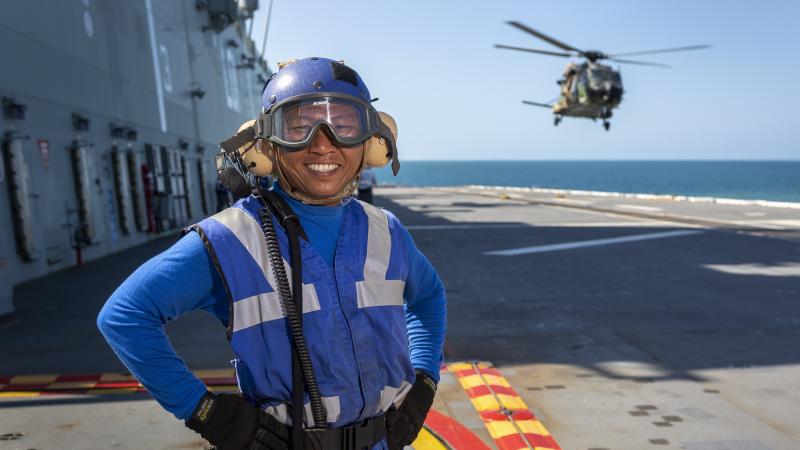 Able Seaman Aviation Support Khin Thaung on the flight deck of HMAS Adelaide during Exercise Sea Wader. Photo: Able Seaman Daniel Goodman