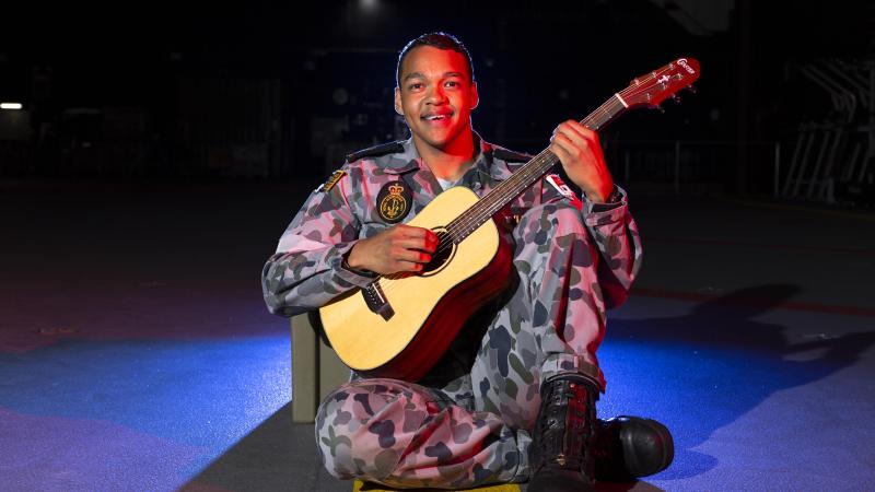 Musical medic Able Seaman Denzel Taylor in HMAS Adelaide. Photo: Able Seaman Daniel Goodman
