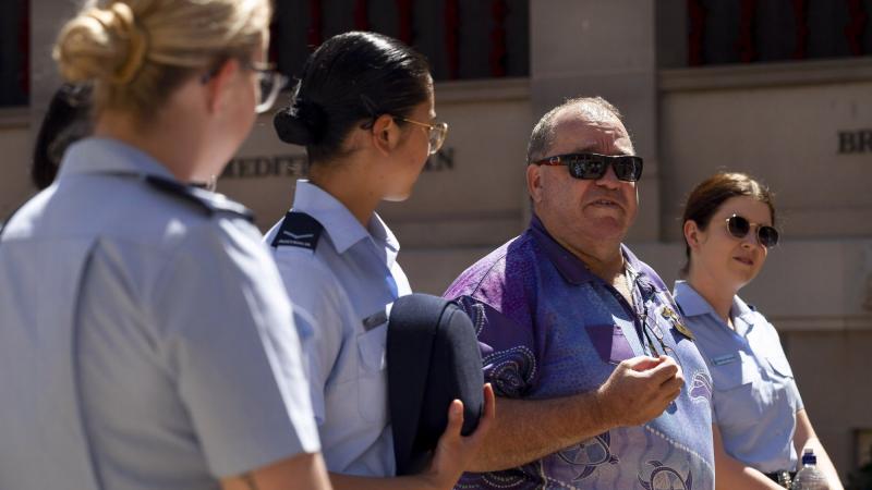  Michael Bell, centre, talks with RAAF members on a guided tour of the Australian War Memorial during NAIDOC Week. Photo: Leading Seaman Craig Walton