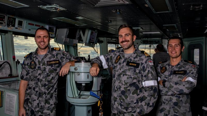 Lieutenants Michael Carpenter, left, Matthew Newman and Sean Klamut on the bridge of HMAS Ballarat during Exercise Malabar. Photo: Leading Seaman Shane Cameron