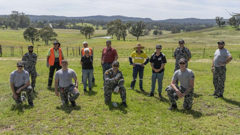 NUSHIP Supply crew with Blaze Aid volunteers and Barry and Nerida Heseltine at their farm in Bega Valley Shire, NSW. Photo: Able Seaman Leon Dafonte Fernandez