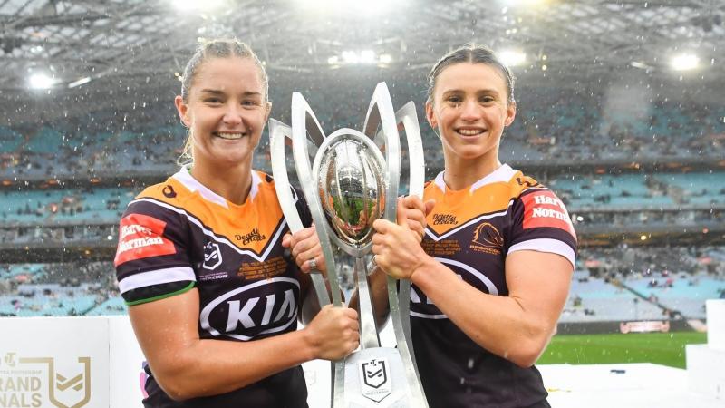 Leading Aircraft Woman Meg Ward, left, and Private Julia Robinson hold the National Rugby League Women's premiership trophy after the Brisbane Broncos' grand final win.