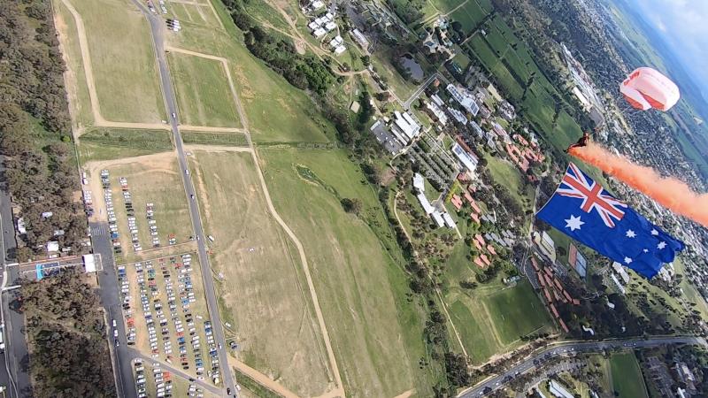 One of the Red Berets carries the Australian flag down to the V8 Supercars Bathurst 1000 track. 