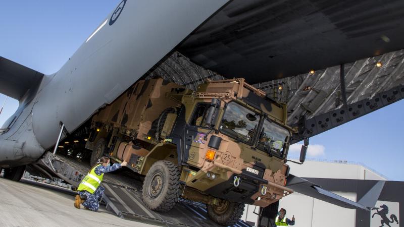 An Army MAN M40 vehicle is loaded onto a C-17A Globemaster III at RAAF Base Amberley. Photo: Sergeant Peter Borys