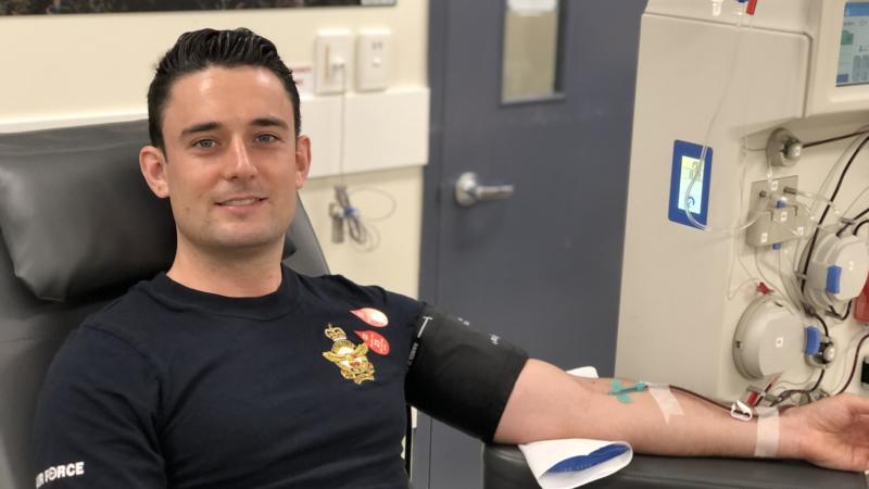 Flight Lieutenant Daniel Wilde, from No. 2 Expeditionary Health Squadron, donates plasma at the Darwin Red Cross Lifeblood donation centre.