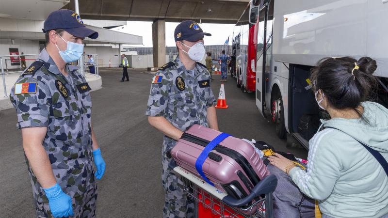 Navy personnel assist at Sydney airport during operation COVID-19 Assist. Photo: Leading Seaman Hadav Harel