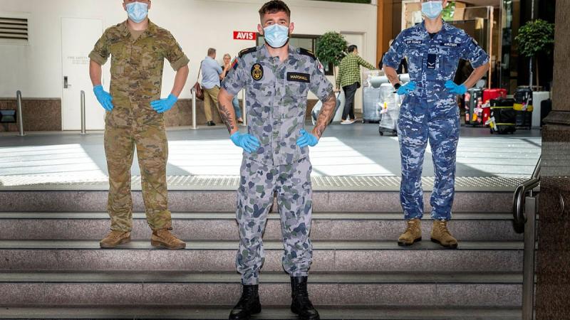 Private Finnleigh Dudley, left, Able Seaman Jacob Marshall and Leading Aircraftwoman Samantha Knutsen on duty at a Sydney hotel during Operation COVID-19 Assist. Photo: Leading Seaman Nadav Harel