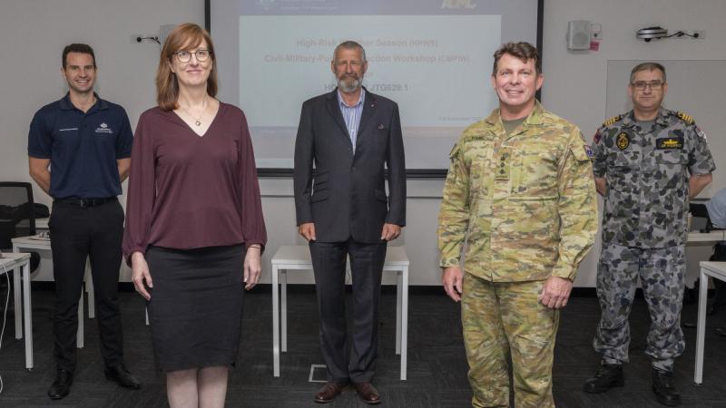 Emergency Management Australia’s James Drummond, left, Australian Civil-Military Centre’s Rachel Walshe, Captain Jim Hutton, Colonel Warwick Young, and Captain Leif Maxfield. Photo: Able Seaman Benjamin Ricketts