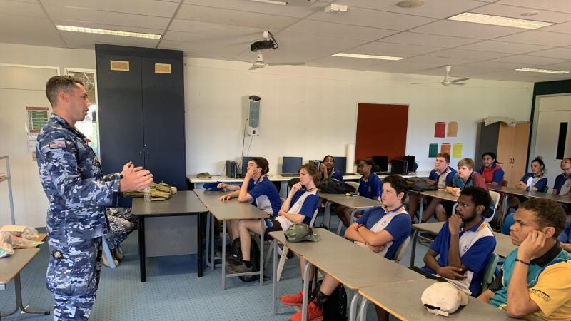 Corporal Jamie Dixon, of No. 383 Contingency Response Squadron, speaks to students at a school in Weipa on Cape York as part of Exercise Woomera Strike.