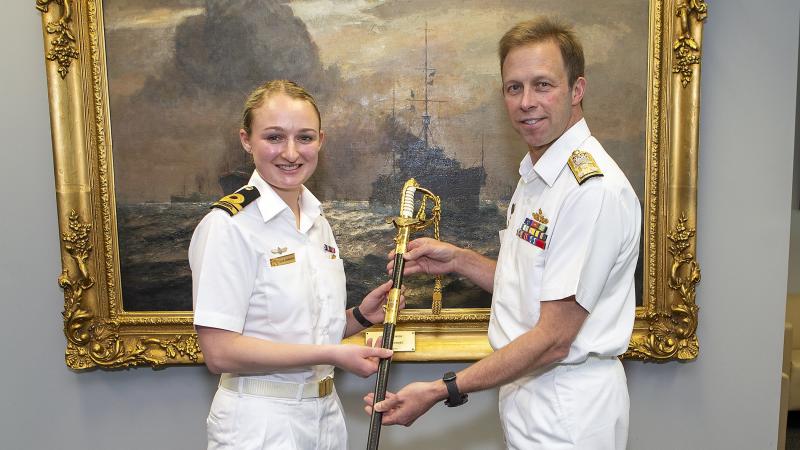Chief of Navy Vice Admiral Michael Noonan presents maritime logistics officer Lieutenant Eleanor Johnston with the Leeuwin Trust Fund Sword. Photo: Leading Seaman James McDougall
